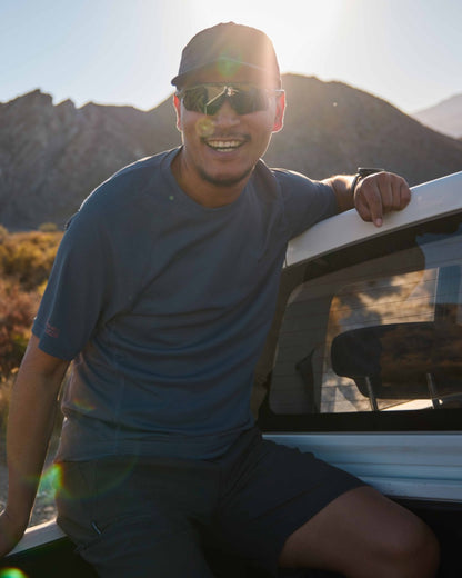 Dark Pewter coloured Craghoppers Mens NosiLife SolarShield+ Short Sleeved T-Shirt on mountain background 