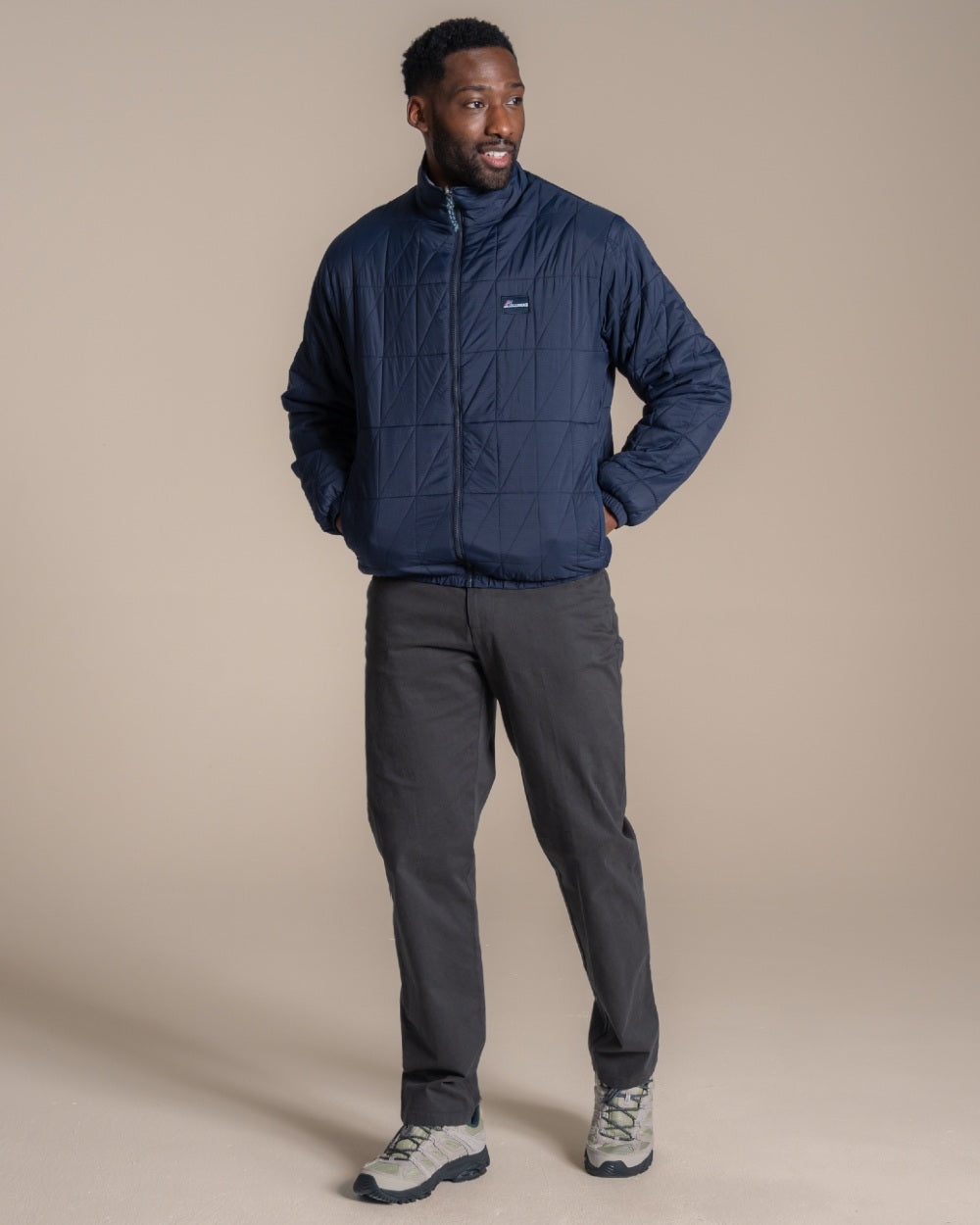 Blue Navy coloured Craghoppers Mens Stuo Jacket on beige background 