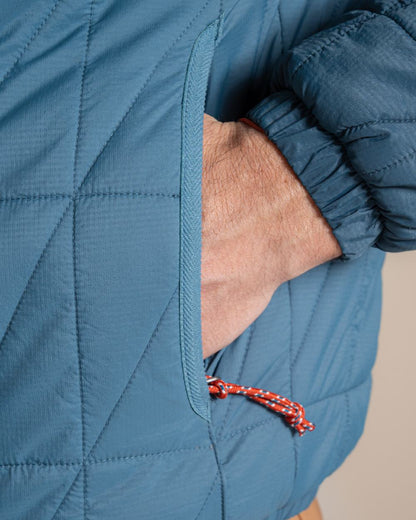 Dark Aegean Blue Winter Storm coloured Craghoppers Stuo Jacket on beige background 