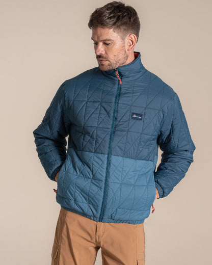 Dark Aegean Blue Winter Storm coloured Craghoppers Stuo Jacket on beige background 