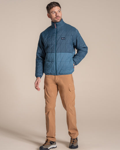 Dark Aegean Blue Winter Storm coloured Craghoppers Stuo Jacket on beige background 