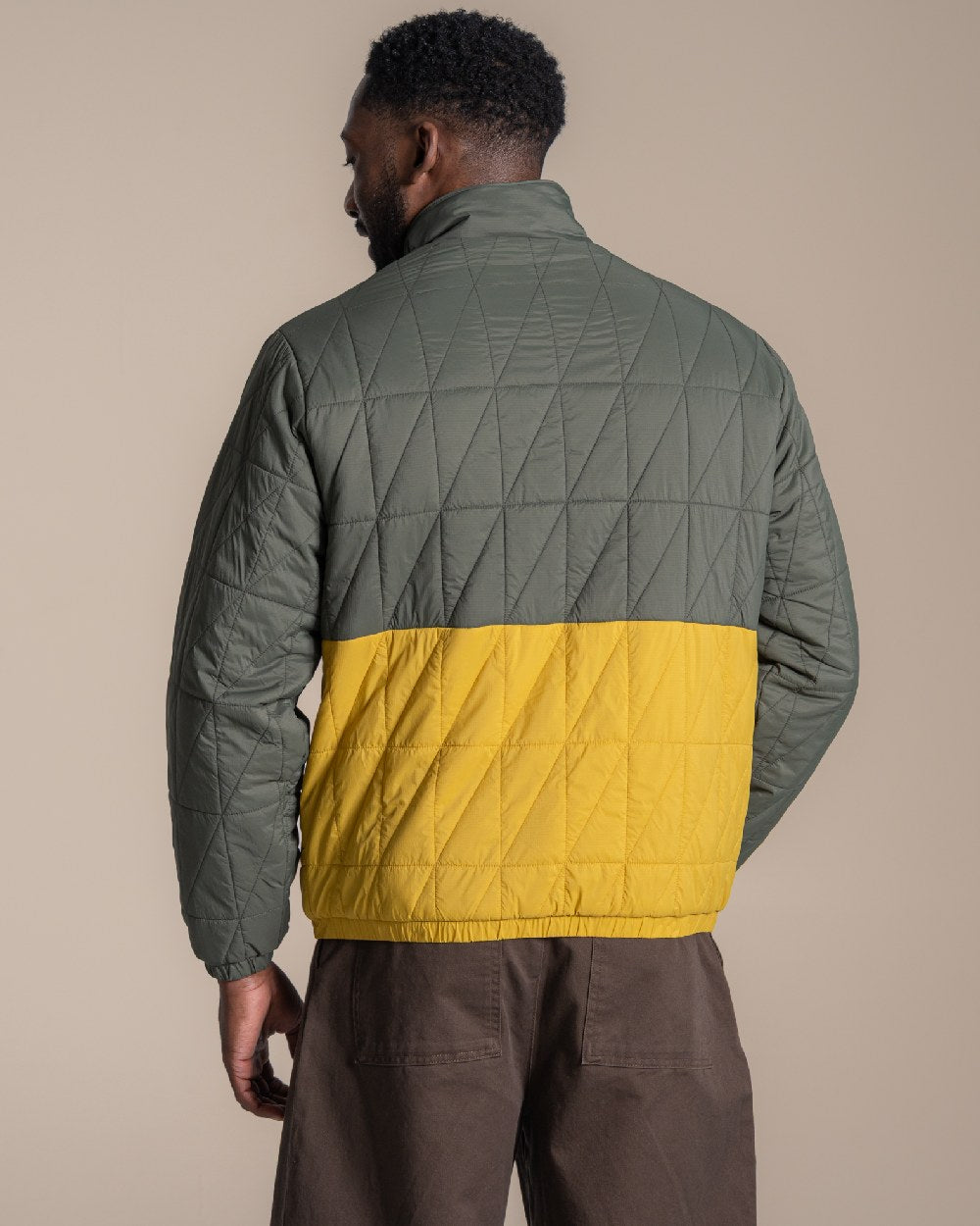 Lagano Green Sulphur Yellow coloured Craghoppers Mens Stuo Jacket on beige background 