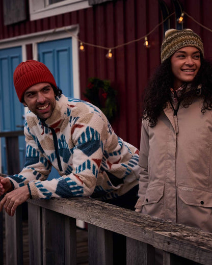 River Blue coloured Craghoppers Mens Tatton II Half Zip on Rustic Cabin background 