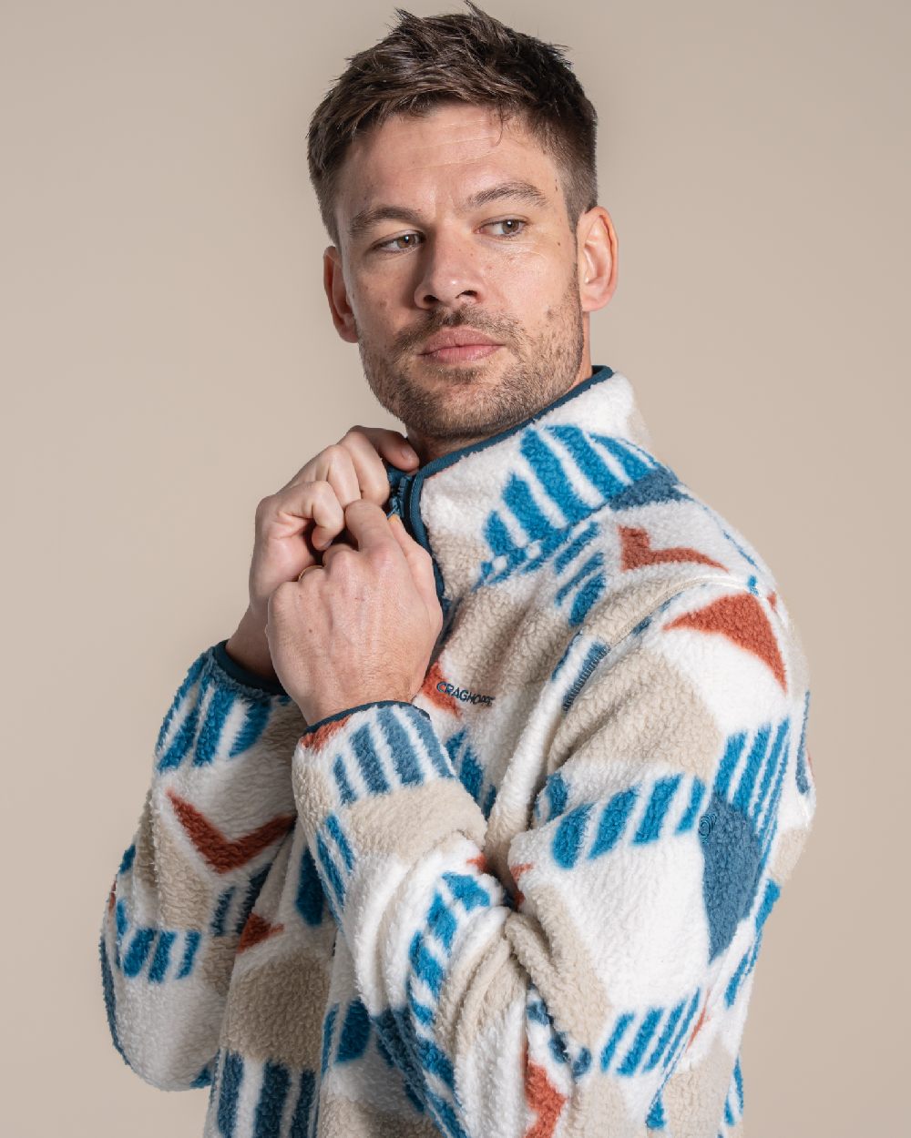 River Blue coloured Craghoppers Mens Tatton II Half Zip on beige background 