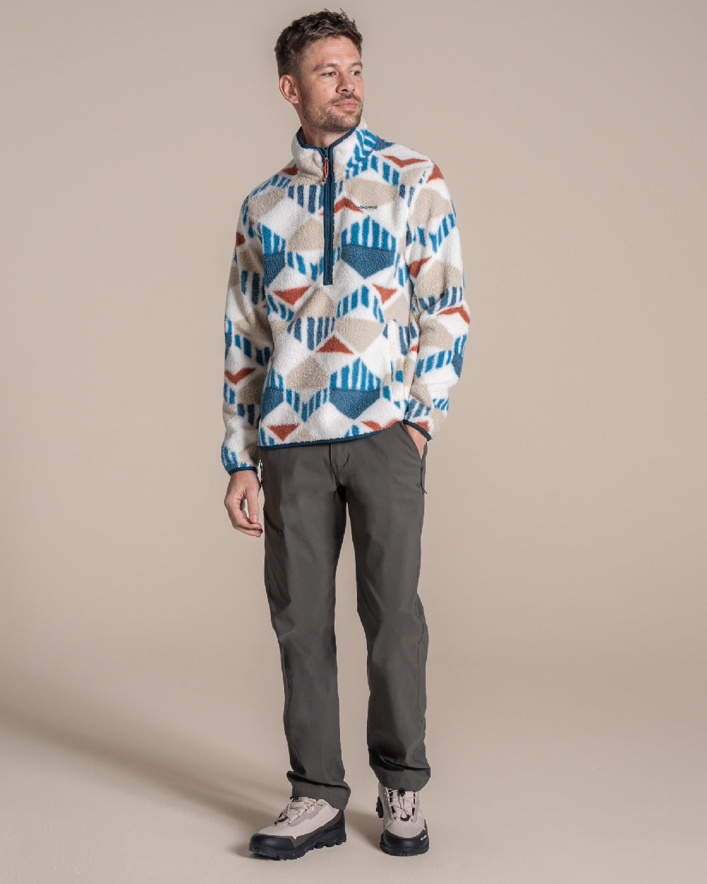 River Blue coloured Craghoppers Mens Tatton II Half Zip on beige background 