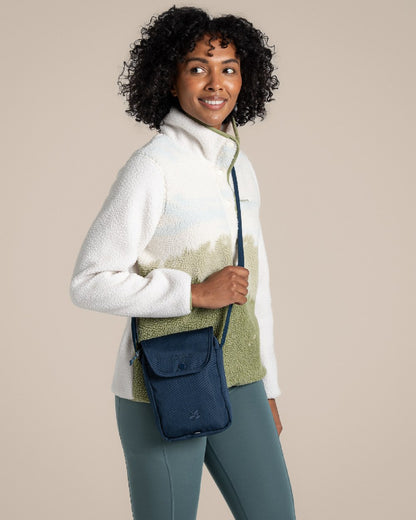Blue Stone Coloured Craghoppers National Trust Kiwi Crossbody on Beige Background 