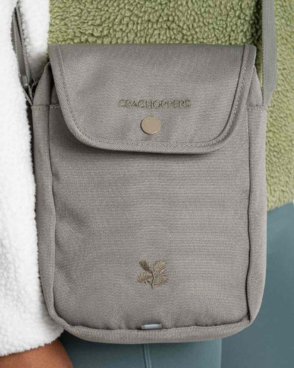 Vert Coloured Craghoppers National Trust Kiwi Crossbody on Beige Background 