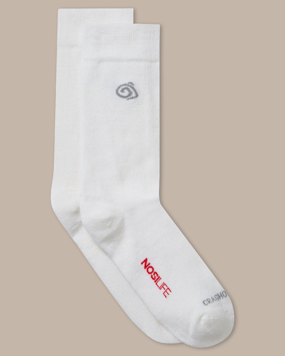 White Coloured raghoppers Nosilife Travel Wool Socks on Beige Background 