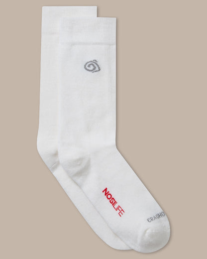 White Coloured raghoppers Nosilife Travel Wool Socks on Beige Background 