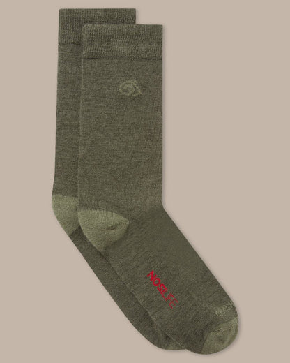 Woodland Green Coloured raghoppers Nosilife Travel Wool Socks on Beige Background 