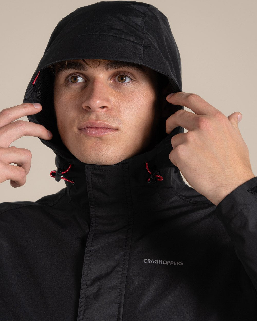 Black coloured Craghoppers Ossus Jacket on beige background 
