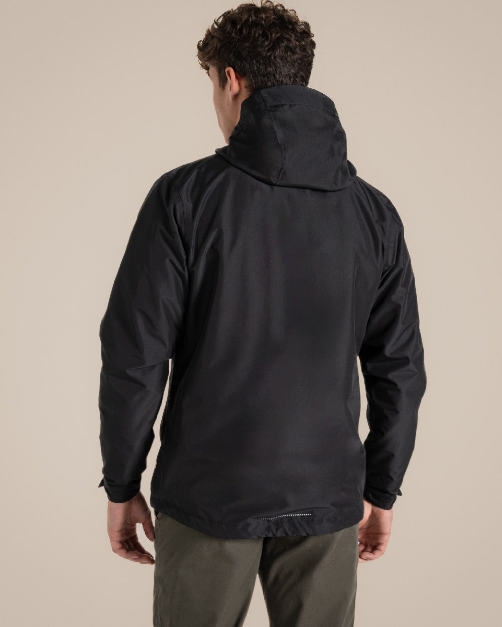 Black coloured Craghoppers Ossus Jacket on beige background 