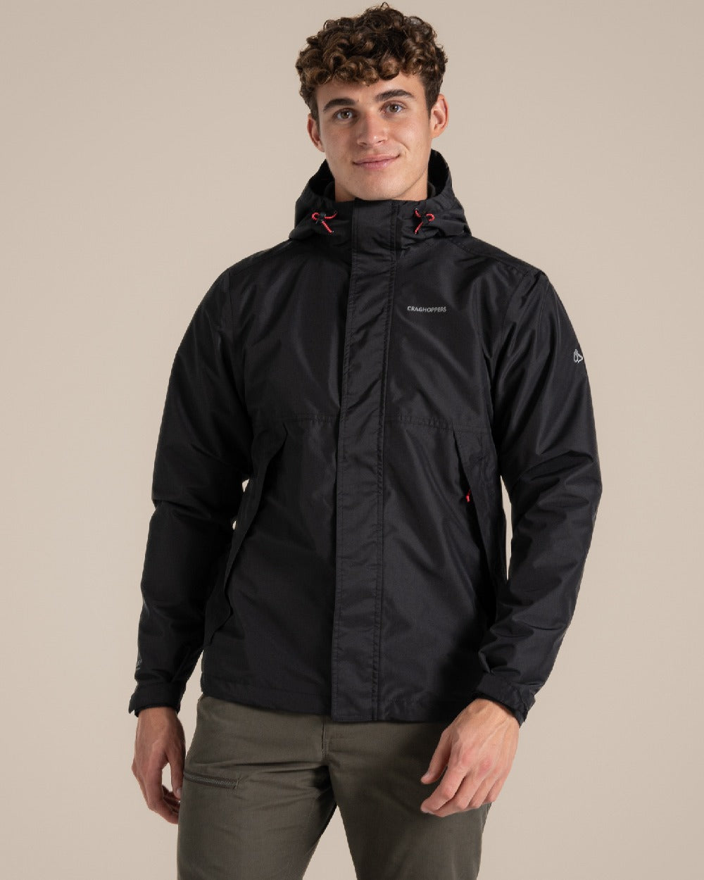 Black coloured Craghoppers Ossus Jacket on beige background 