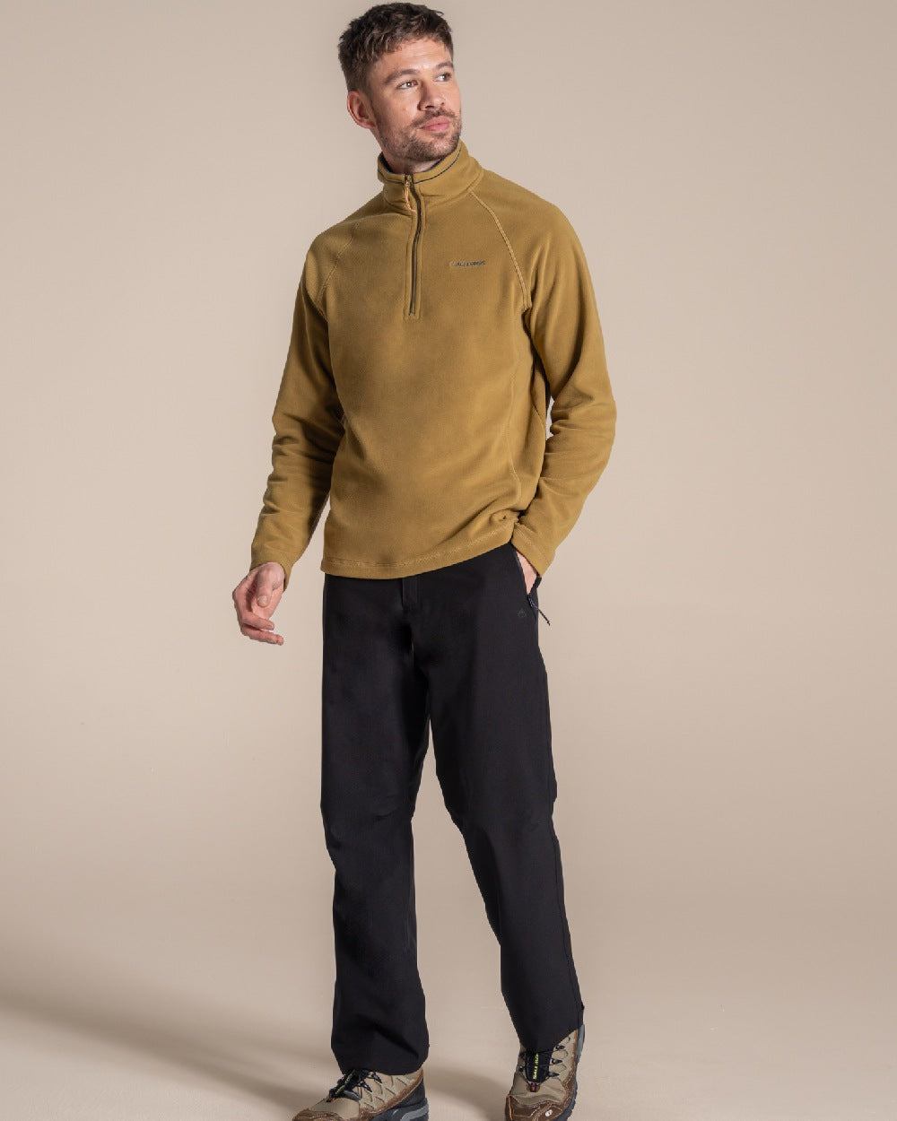 Black colour Craghoppers Steall Pro Thermo Waterproof Trouser on beige background 