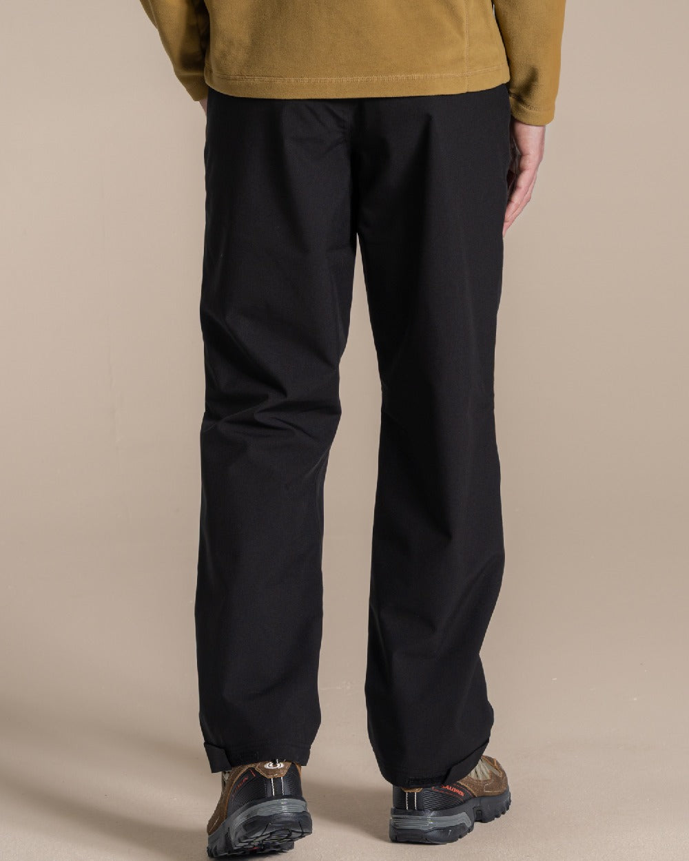 Black colour Craghoppers Steall Pro Thermo Waterproof Trouser on beige background 