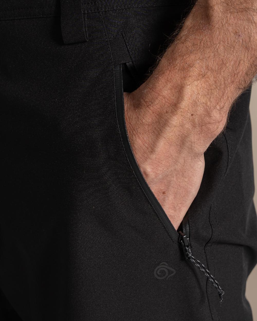 Black colour Craghoppers Steall Pro Thermo Waterproof Trouser on beige background 