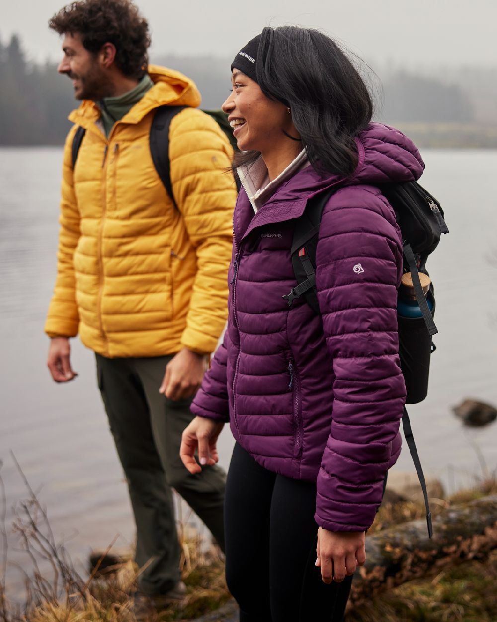 Beet coloured Craghoppers Womens Compresslite VIII Hooded Jacket on Lake background 