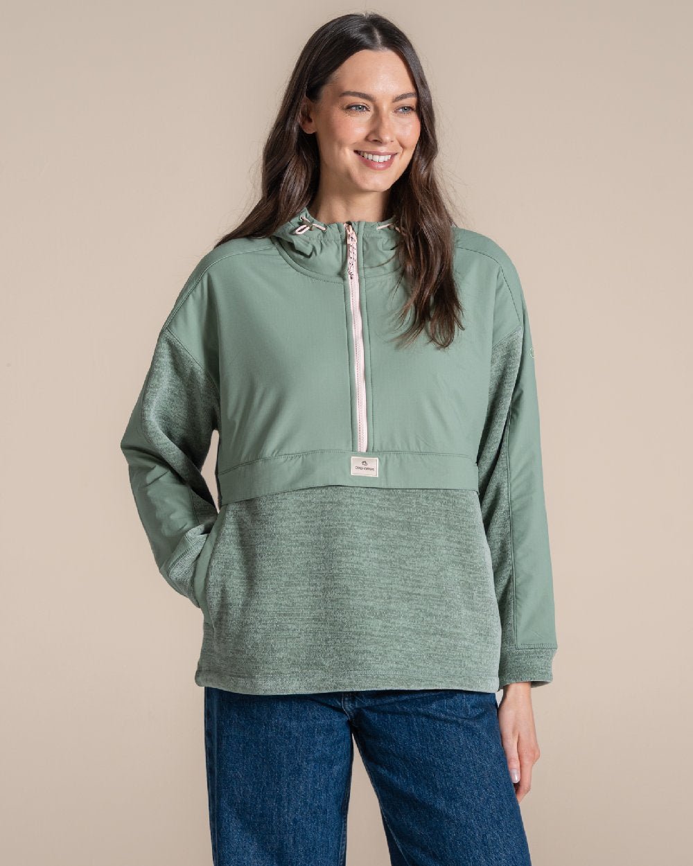 Glacial Green coloured Craghoppers Womens Hanna Hooded Overhead on beige background 
