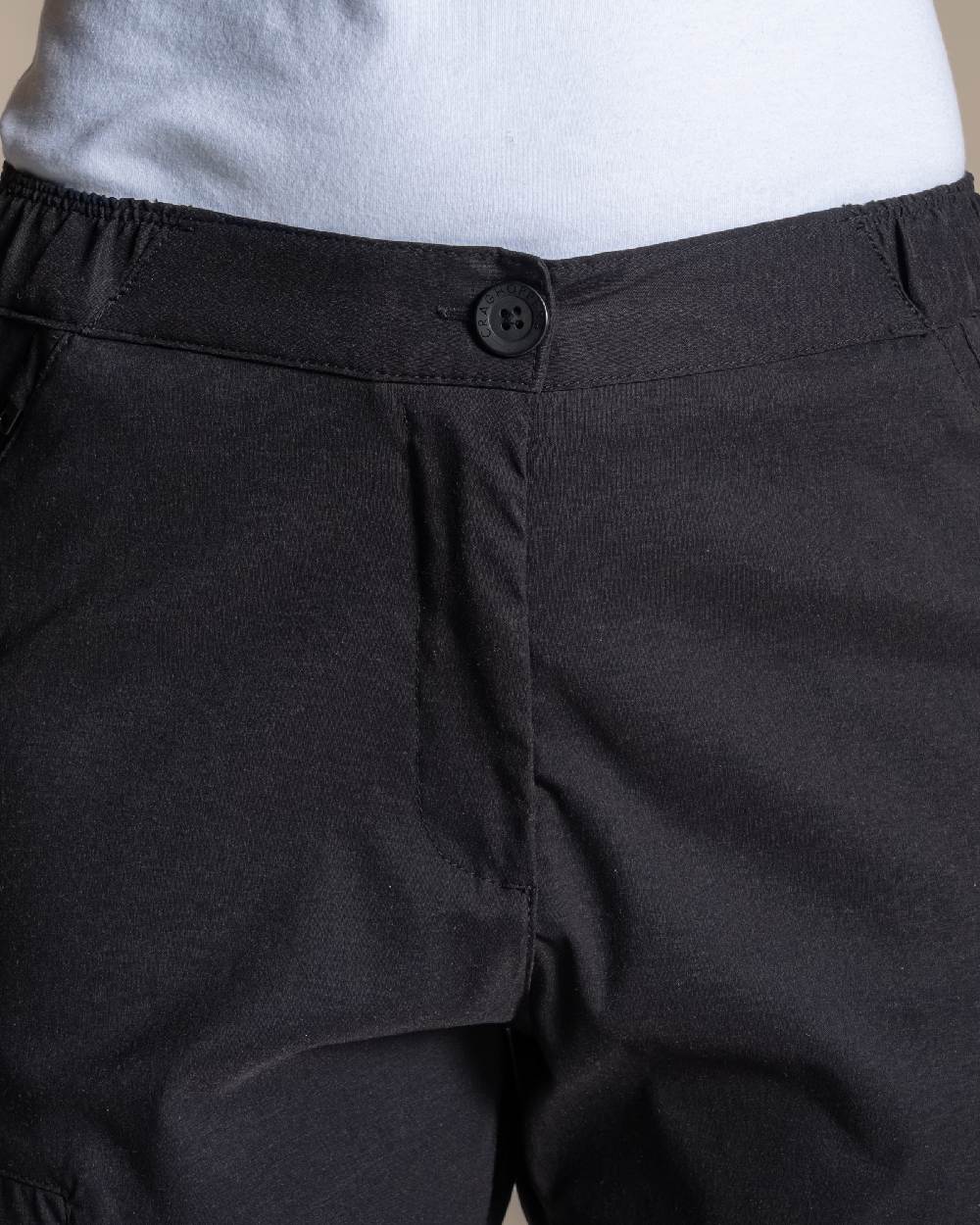Black Coloured Womens KiwiPro Barrel Trouser on Beige Background 