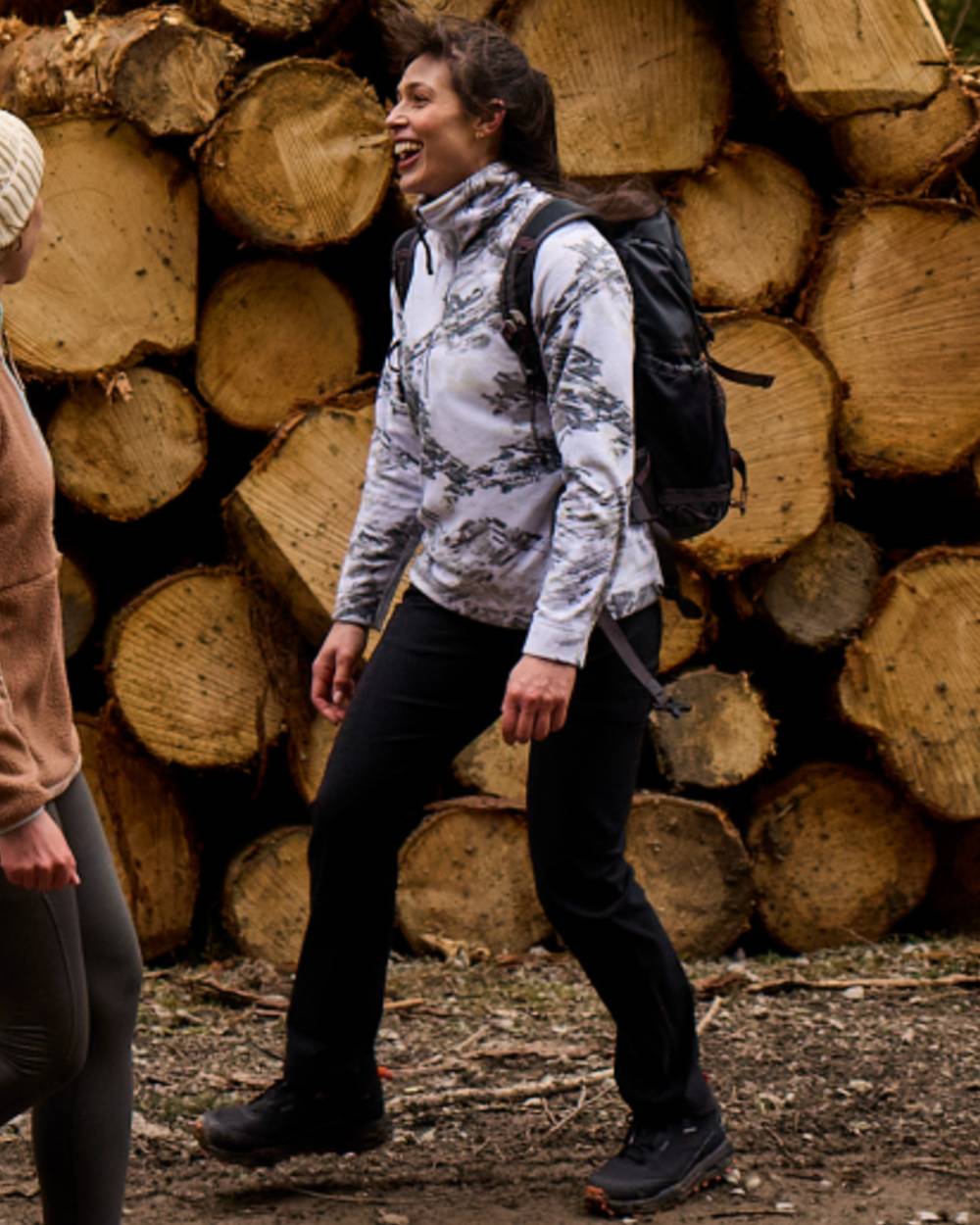 Black coloured Craghoppers Womens Kiwi Pro Cargo Trousers on wood background 