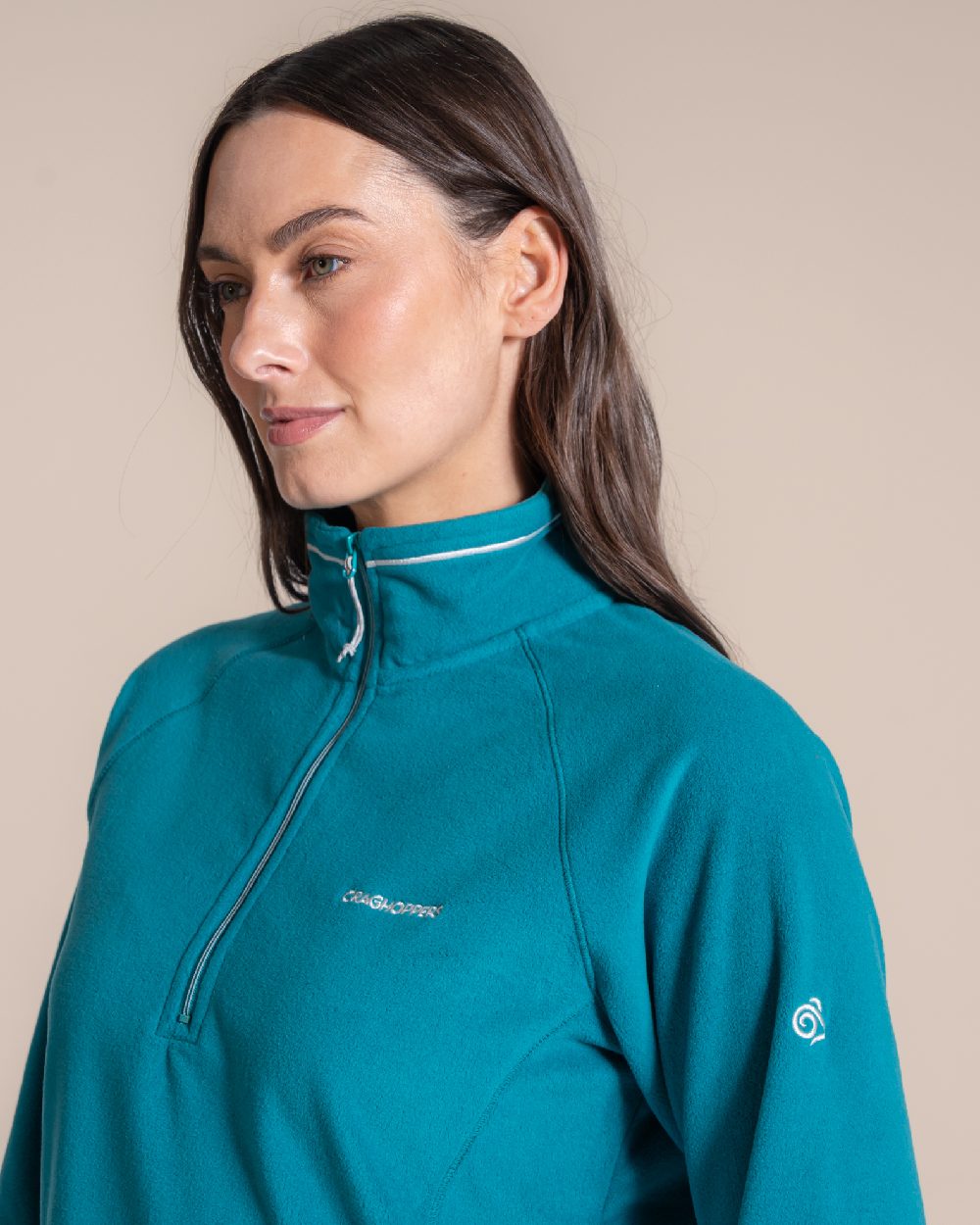 Empress Teal Coloured Craghoppers Womens Miska Half-Zip Fleece on beige background 