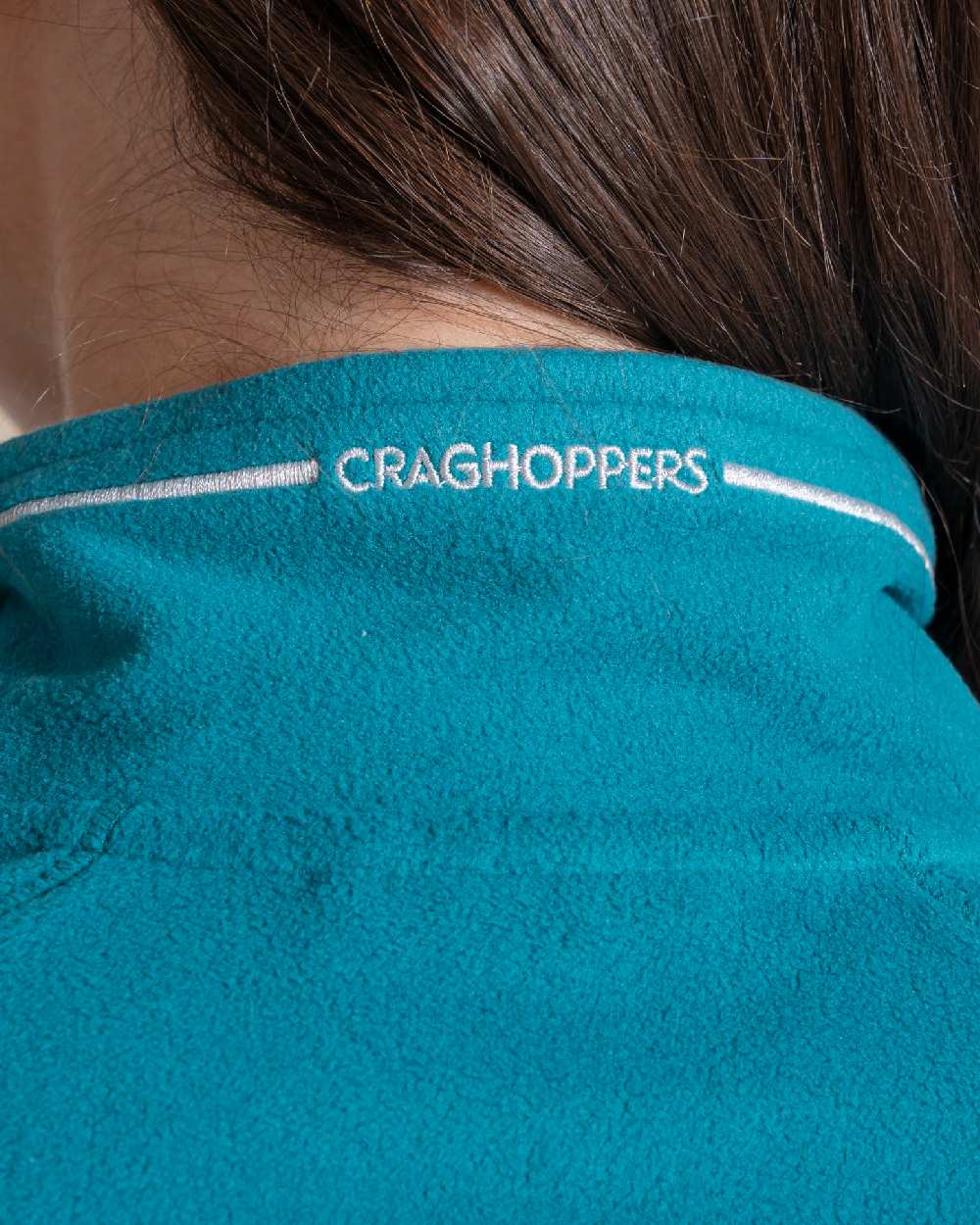 Empress Teal Coloured Craghoppers Womens Miska Half-Zip Fleece on beige background 