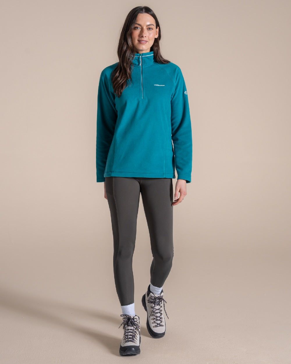 Empress Teal Coloured Craghoppers Womens Miska Half-Zip Fleece on beige background 