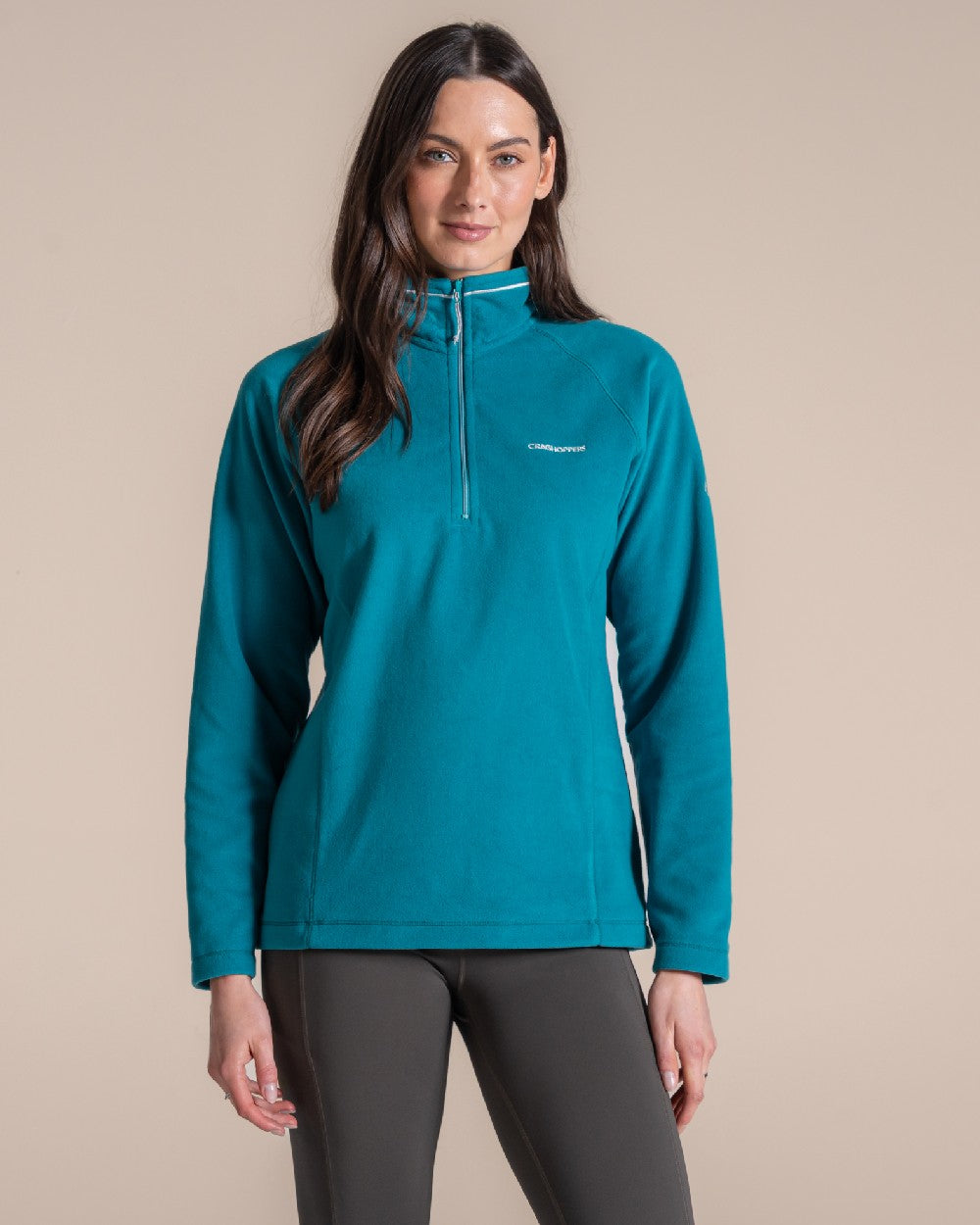 Empress Teal Coloured Craghoppers Womens Miska Half-Zip Fleece on beige background 