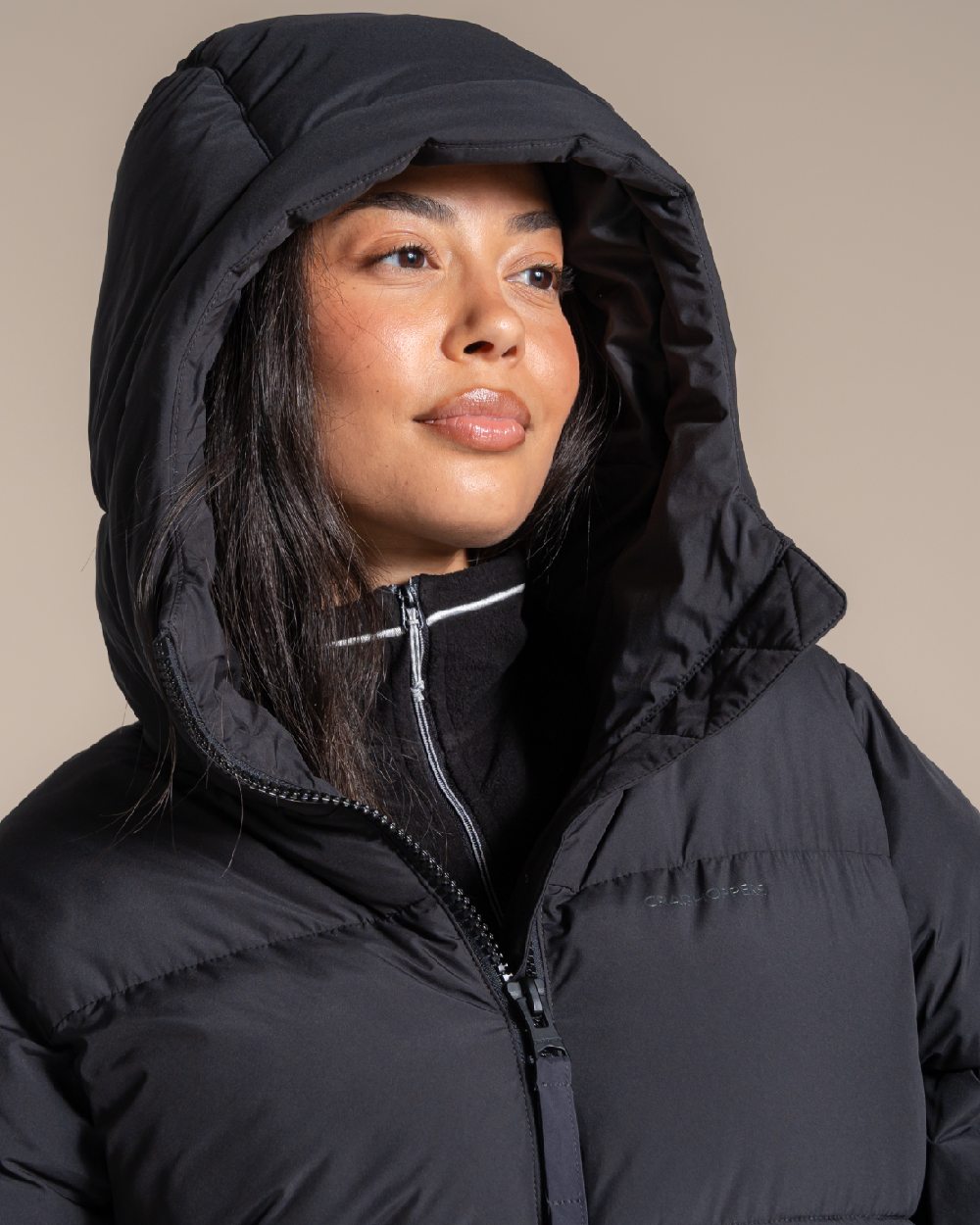 Black coloured Craghoppers Womens Narlia II Hooded Jacket on beige background 