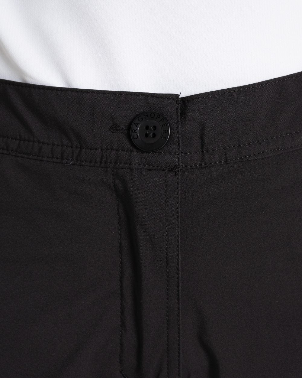 Black coloured Craghoppers Womens Natales Waterproof Lightweight Cargo Trousers on white background 