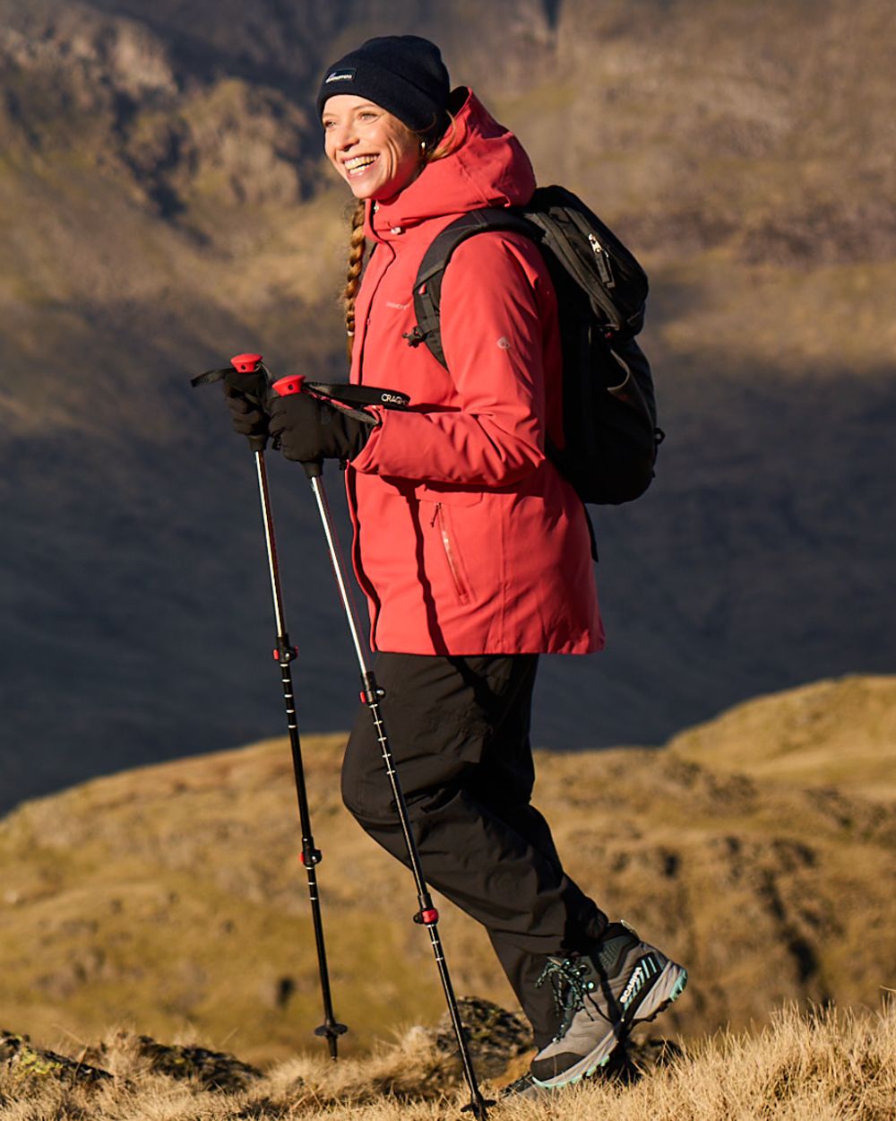 Black coloured Craghoppers Womens Natales Waterproof Lightweight Cargo Trousers on mountain background 