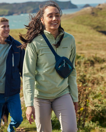 Sage coloured Craghoppers Womens National Trust Miska Half Zip Top on mountain background 