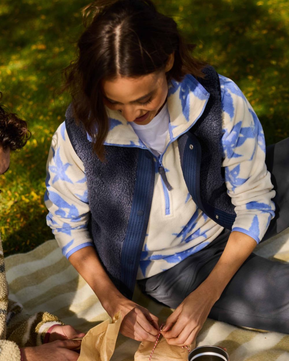 Vinca Blue Print coloured Craghoppers Womens National Trust Reedmace Half Zip Fleece Top on grassy background 