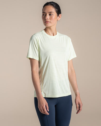 Pear Drop coloured Craghoppers Womens NosiLIfe SolarShield+ Short Sleeved T-Shirt on beige background 