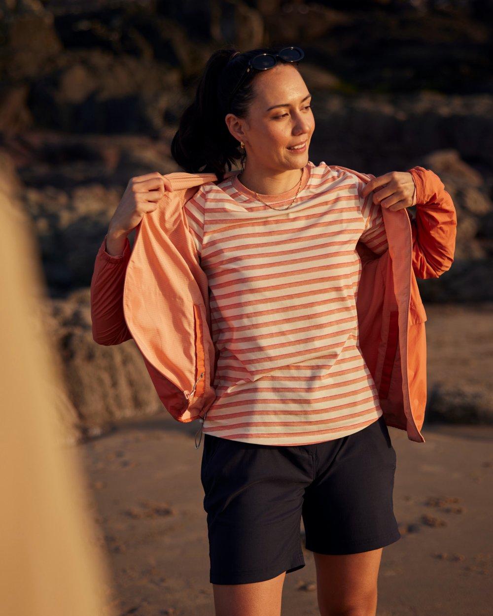 Clay Stripe coloured Craghoppers Womens NosiLife Akona Long Sleeved Top on beach background 