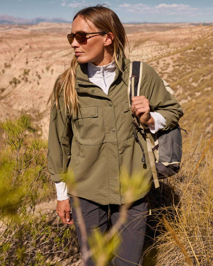 Wild Olive coloured Craghoppers Womens NosiLife Farah Jacket on mountain background 