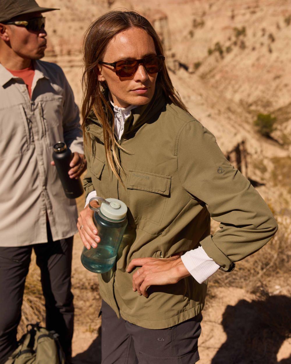 Wild Olive coloured Craghoppers Womens NosiLife Farah Jacket on mountain background 