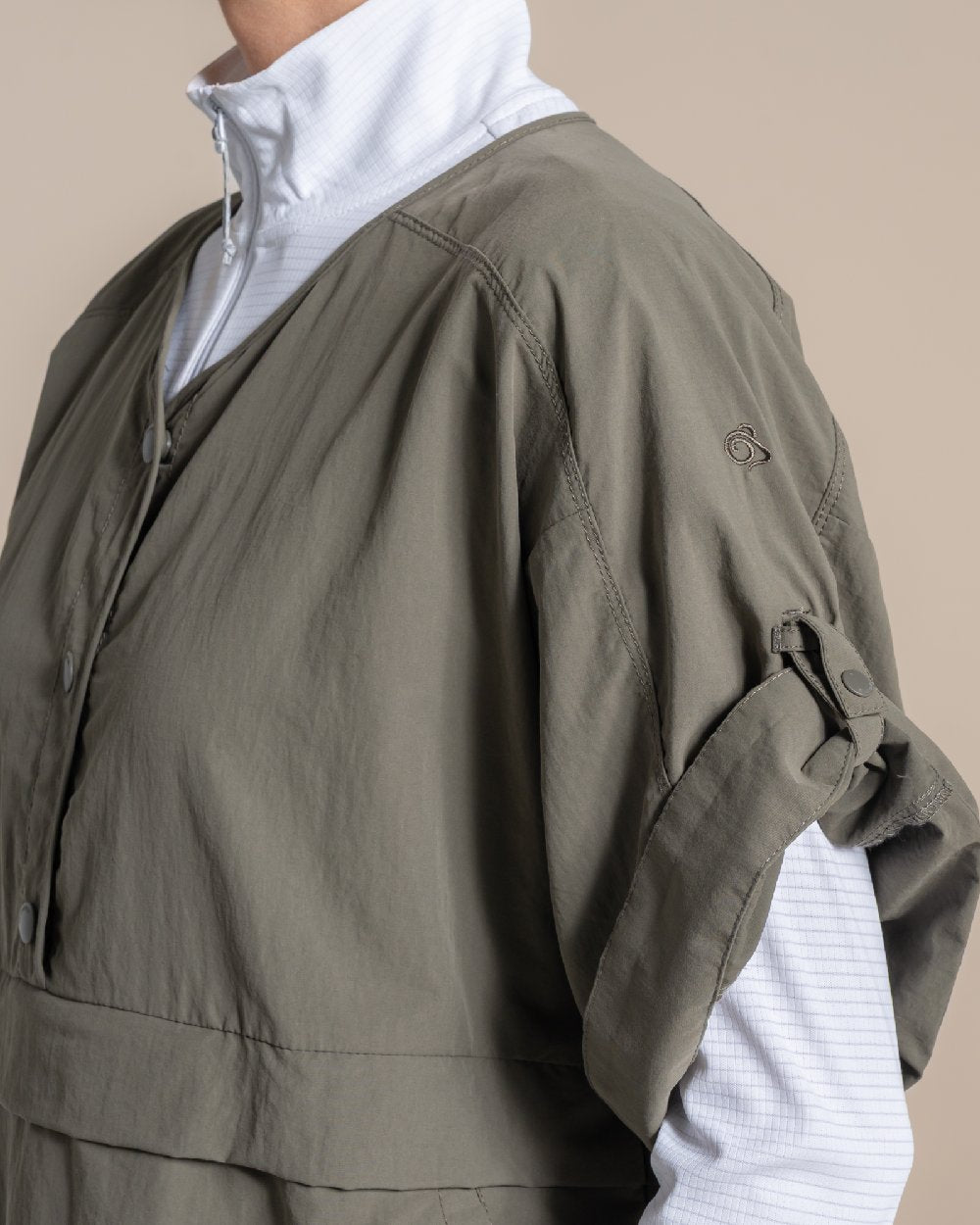 Wild Olive Coloured Craghoppers Womens Nosilife Medina Short Sleeved Overhead Shirt on Beige Background 