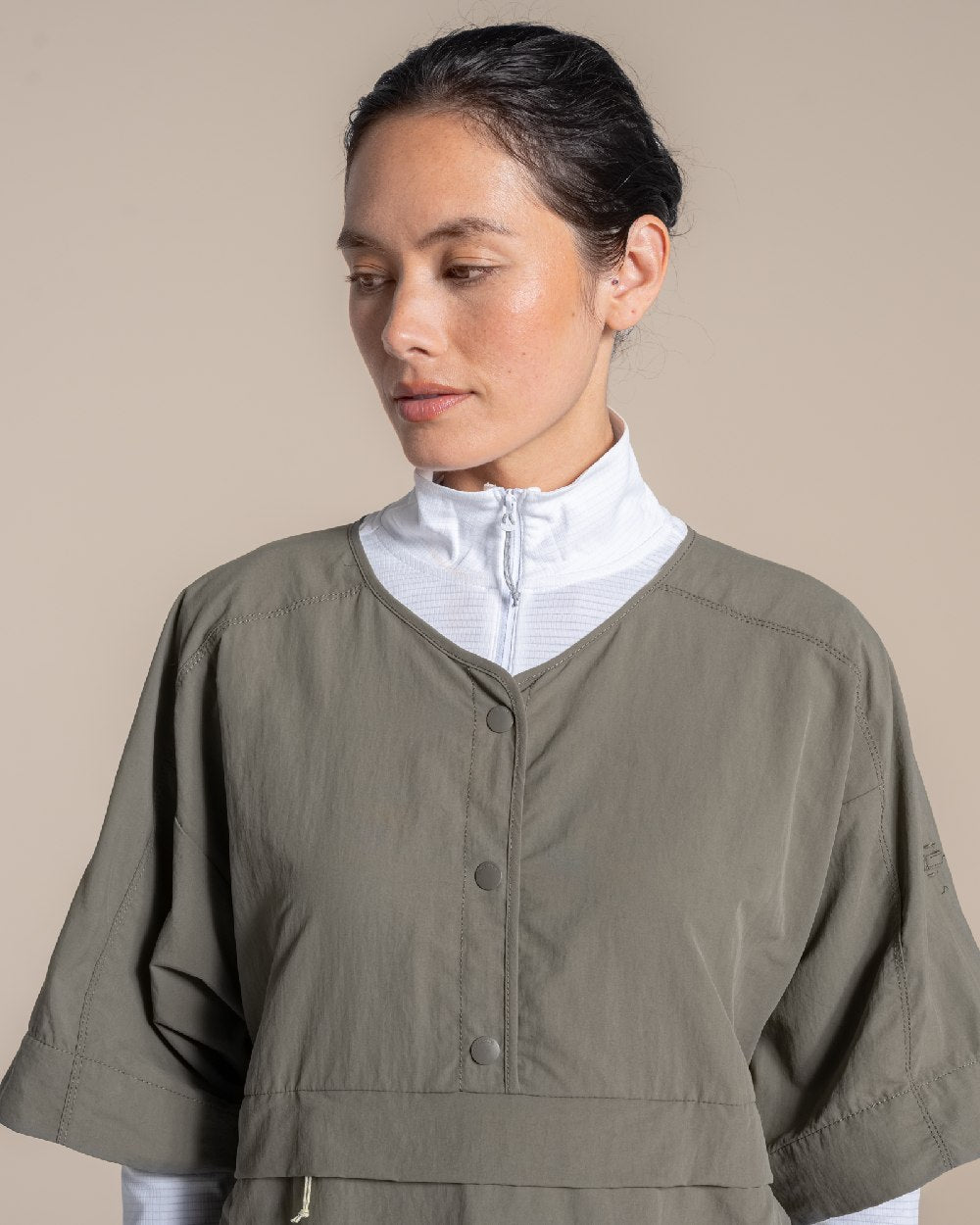 Wild Olive Coloured Craghoppers Womens Nosilife Medina Short Sleeved Overhead Shirt on Beige Background 