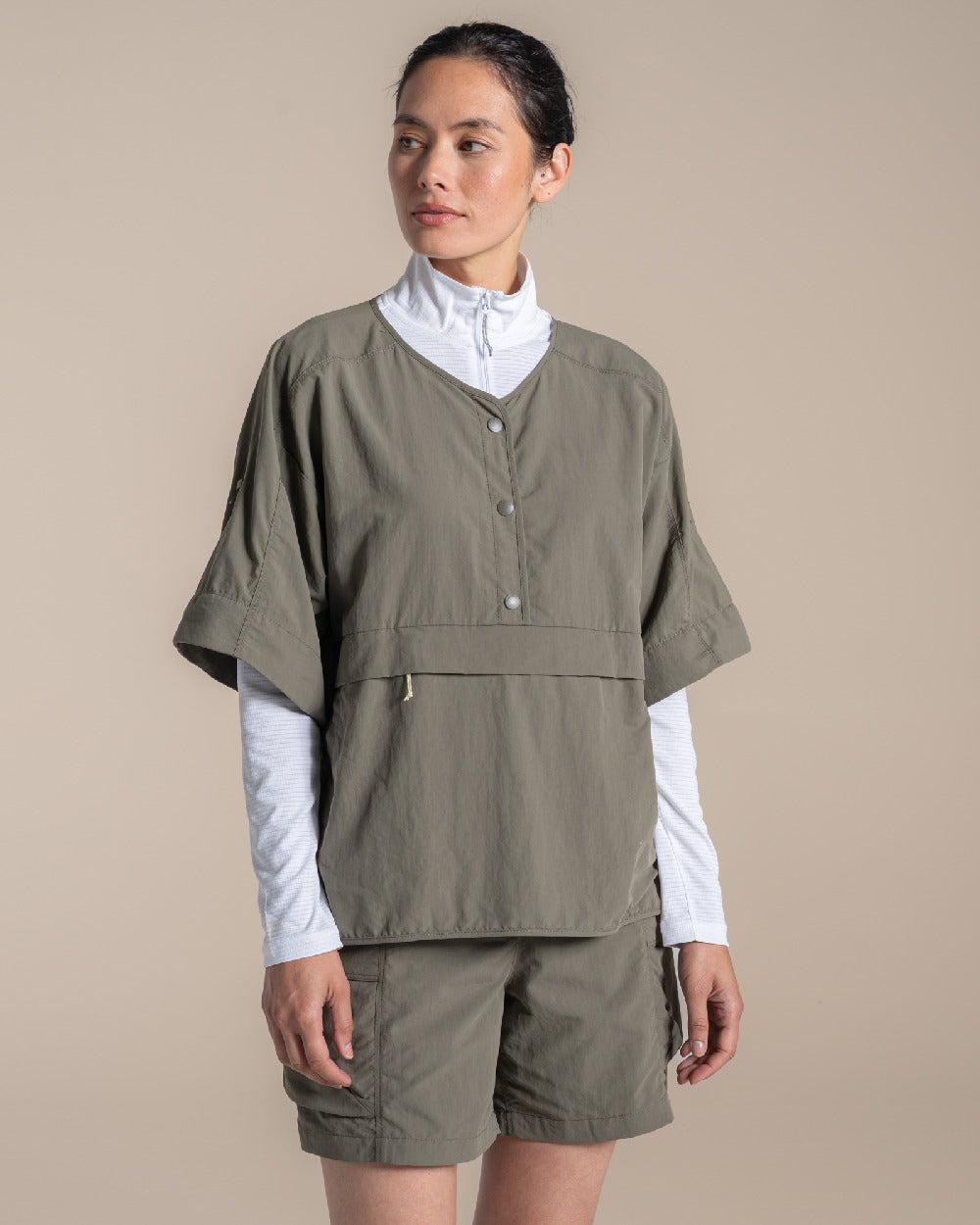 Wild Olive Coloured Craghoppers Womens Nosilife Medina Short Sleeved Overhead Shirt on Beige Background 