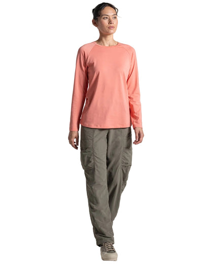 Spiced Apricot coloured Craghoppers Womens NosiLife Nour Long Sleeved T-Shirt on white background 