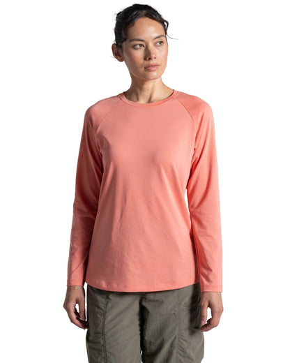 Spiced Apricot coloured Craghoppers Womens NosiLife Nour Long Sleeved T-Shirt on white background 