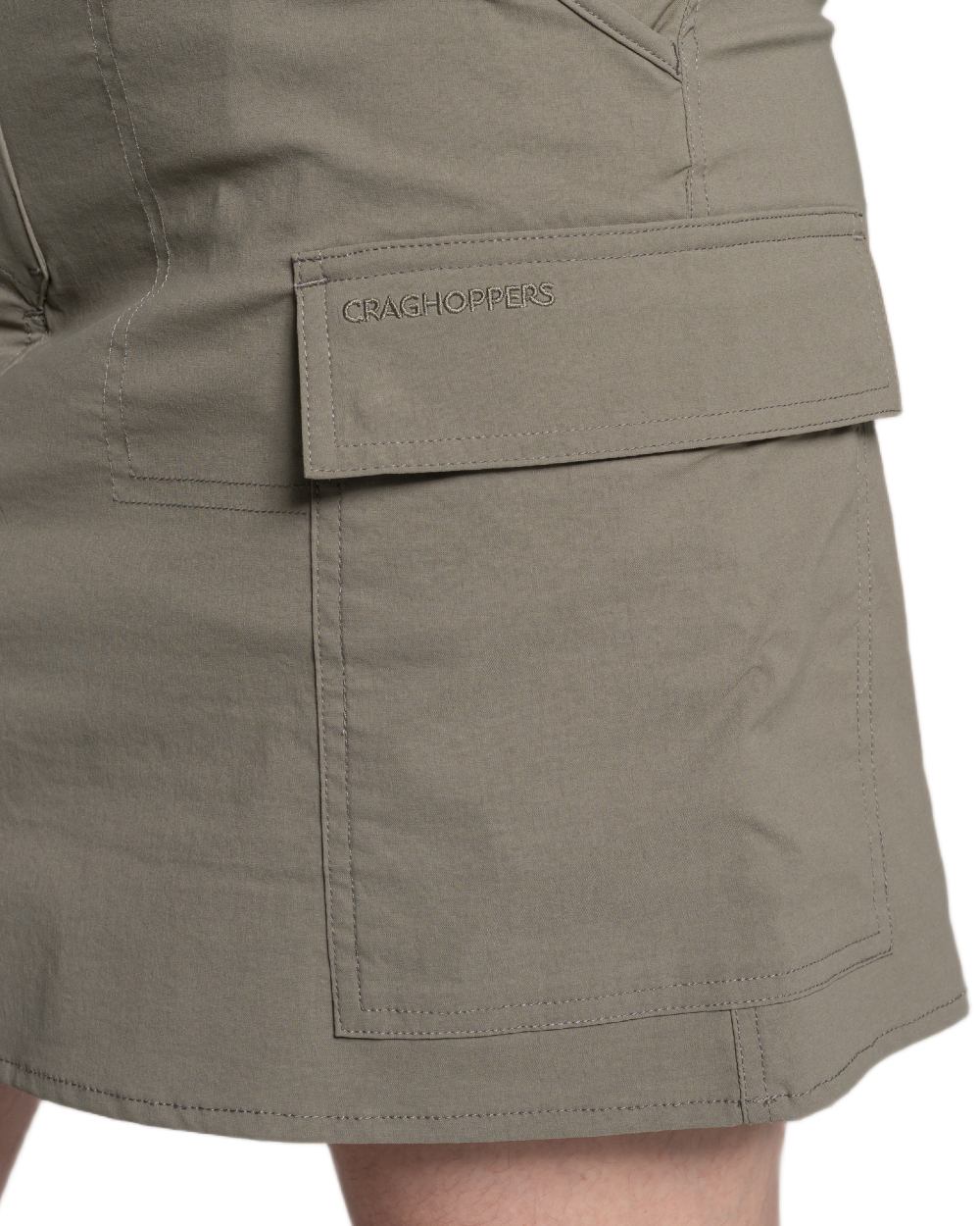 Wild Olive coloured Craghoppers Womens NosiLife Pro Cargo Skort on white background 