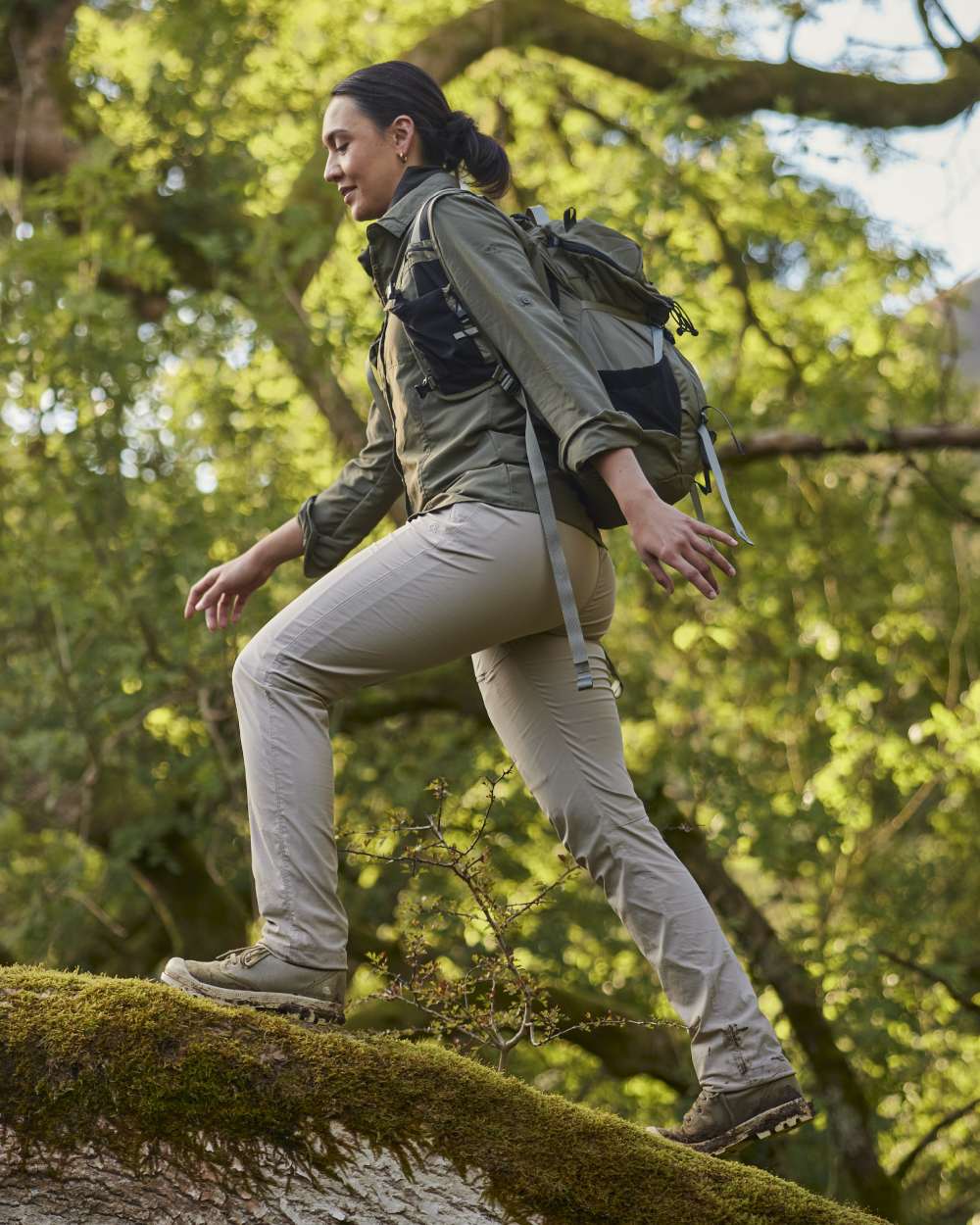 Soft Mushroom coloured Craghoppers Womens NosiLife Pro Trousers III on forest background 