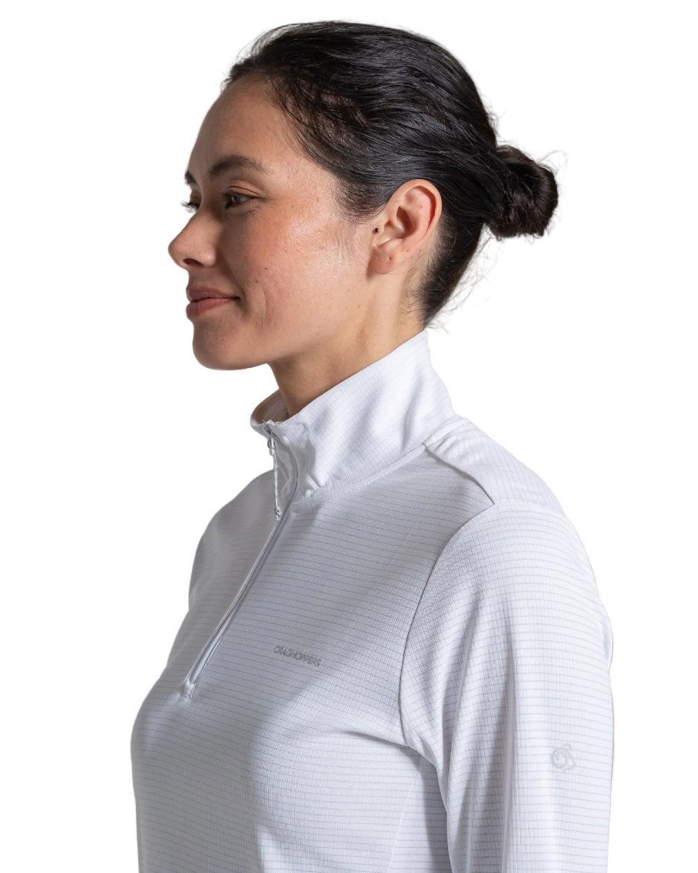 White coloured Craghoppers Womens NosiLife SolarShield+ Half Zip Top on white background 