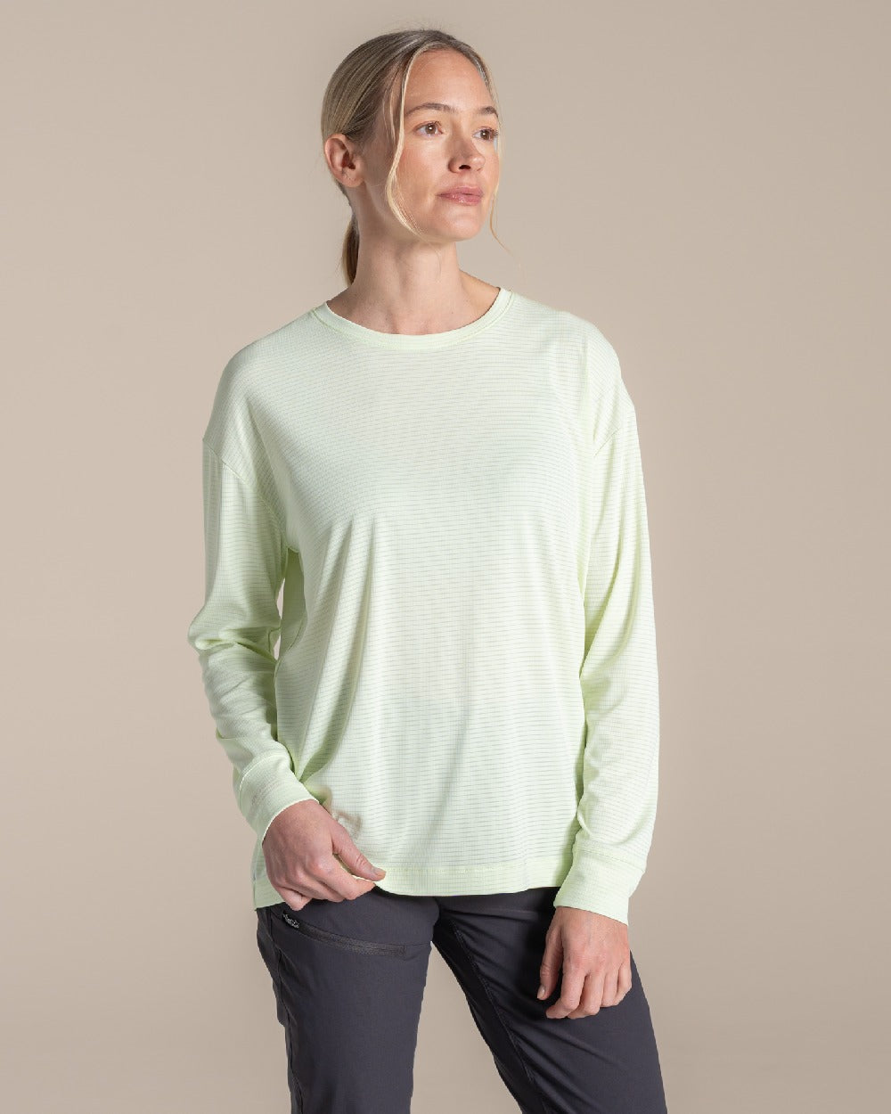 Pear Drop coloured Craghoppers Womens NosiLife SolarShield+ Long Sleeved T-Shirt on beige background 