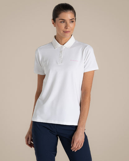 White Coloured Craghoppers Womens Nosilife Thornbuy Short Sleeved Polo Top on Beige Background 