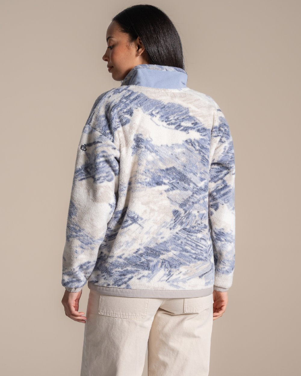 Mist Blue coloured Craghoppers Womens Sanaa Half Zip on beige background 