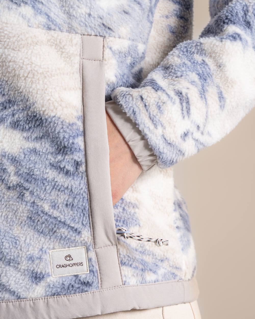 Mist Blue coloured Craghoppers Womens Sanaa Half Zip on beige background 