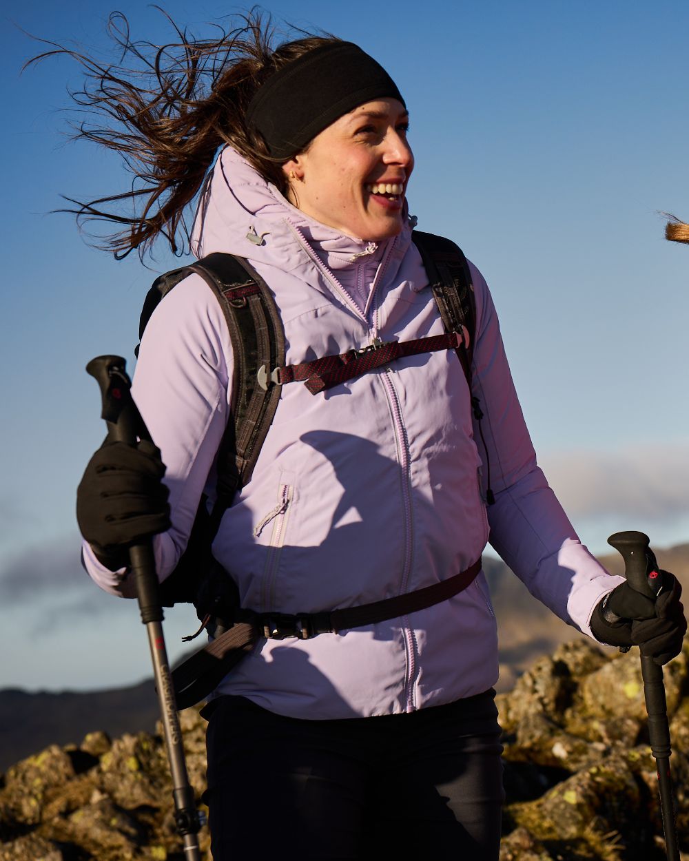 Parma Violet coloured Craghoppers Womens Solla Waterproof Jacket on mountain background 